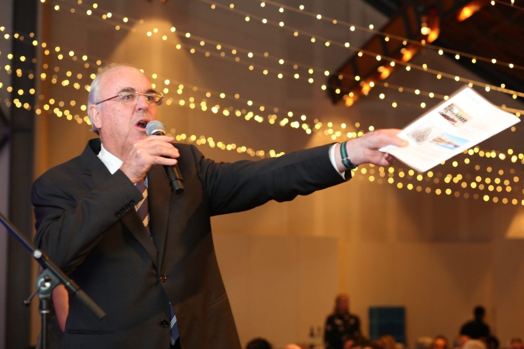 Man speaking at charity event